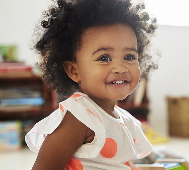 Toddler with healthy smile thanks to children's dentistry