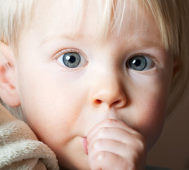 Toddler sucking his thumb