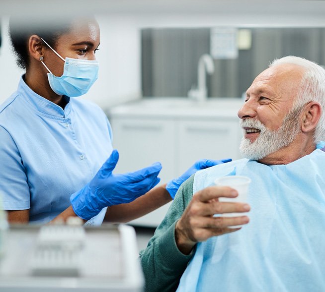 a dentist discussing dentures in Mt. Dora with patient