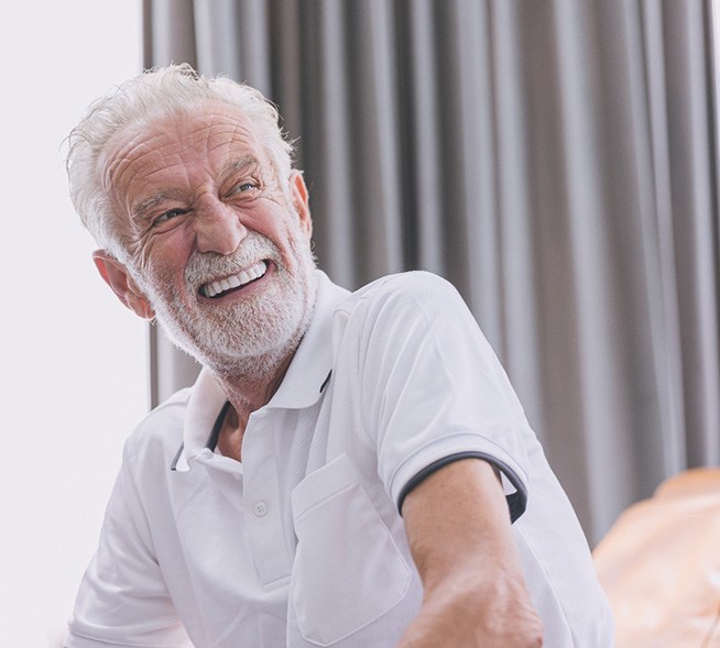 a man smiling with dentures in Mt. Dora