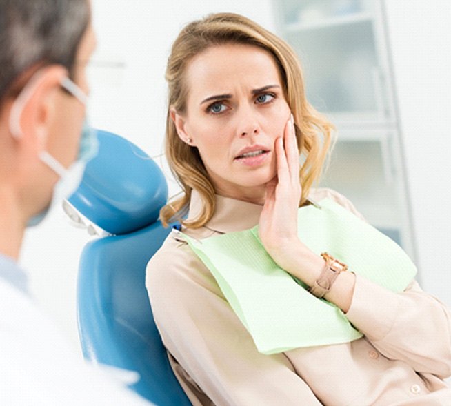 Female patient visiting an emergency dentist in Mount Dora, FL for toothache