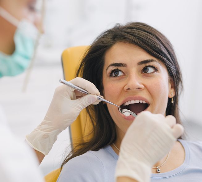 Dentist performing a tooth extraction