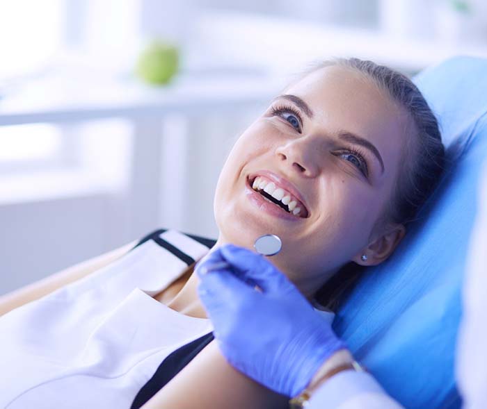 Happy patient visiting her dentist in Mt. Dora