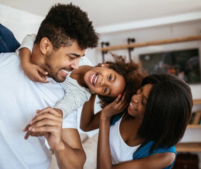 Family of three with healthy smiles