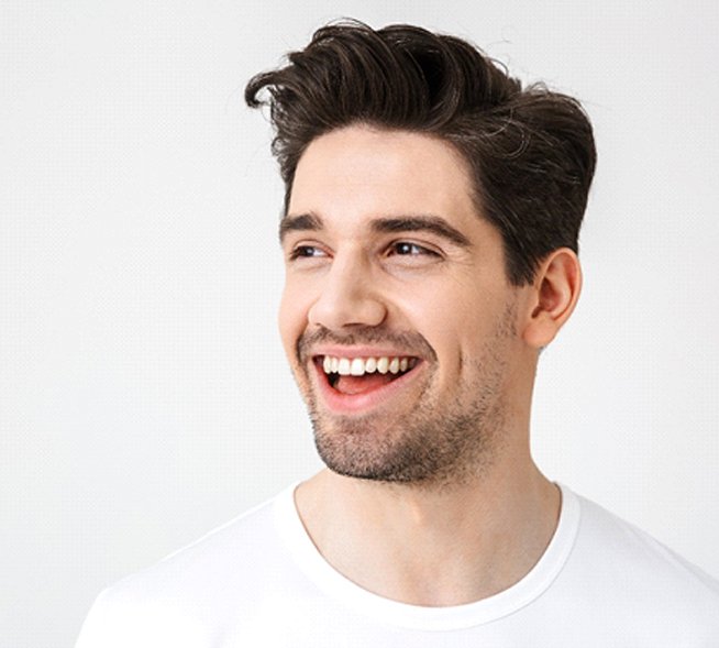 man smiling after getting teeth whitening in Mt. Dora