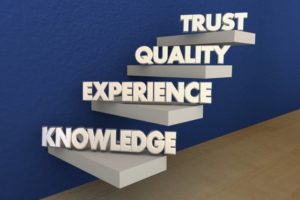 steps with the words "Knowledge", "Experience", "Quality", and "Trust" on them