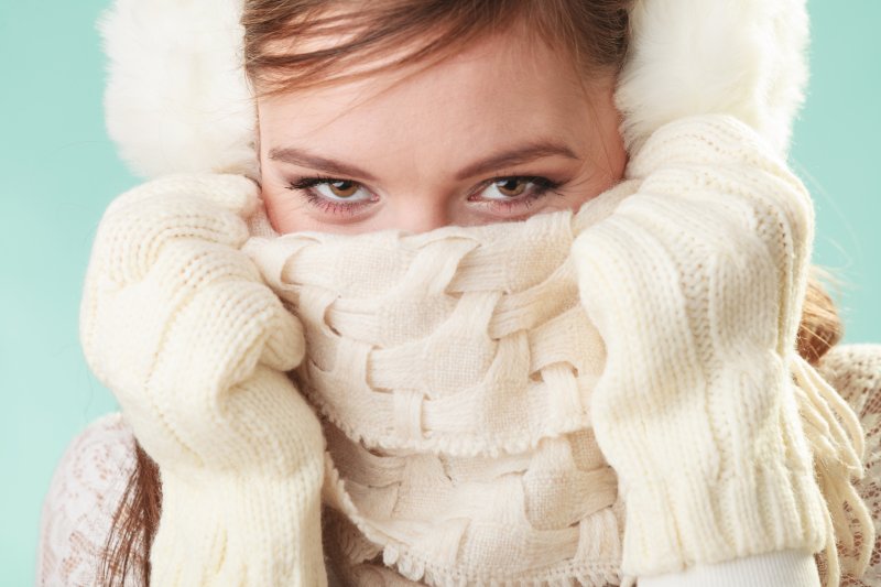 a woman hiding her winter mouth issues in Mt. Dora