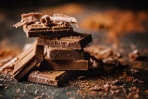 Dark chocolate squares stacked up.